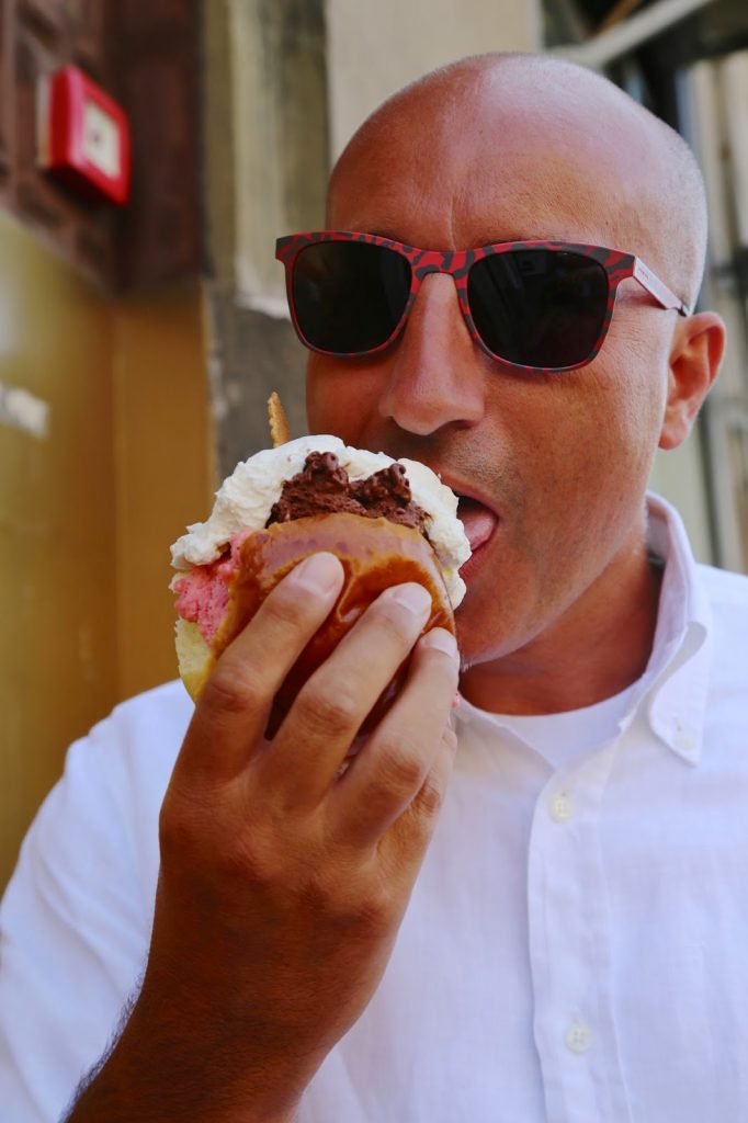 Sicilian eating ice cream sandwich, Palermo, Sicily