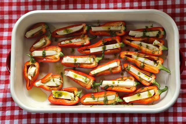 Baby peppers stuffed with halloumi and a pesto glaze recipe