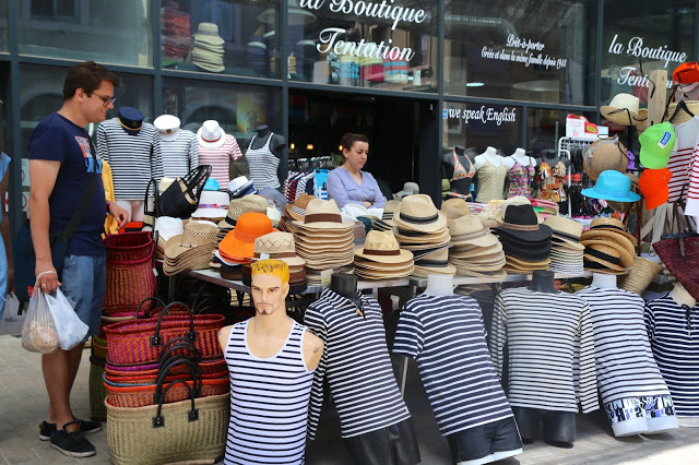 Selling boaters and striped tshirts at Sète market, South of France